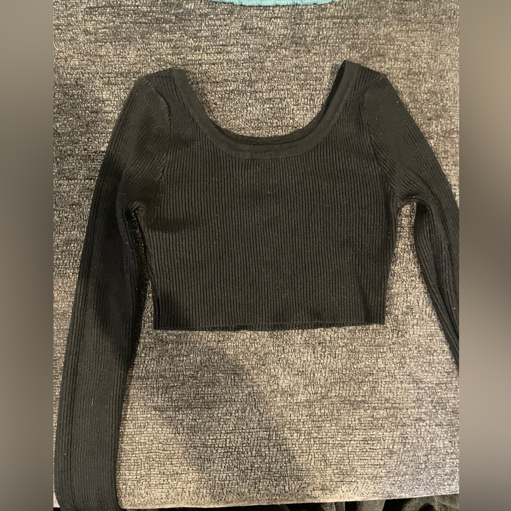 small, black cropped black long sleeve